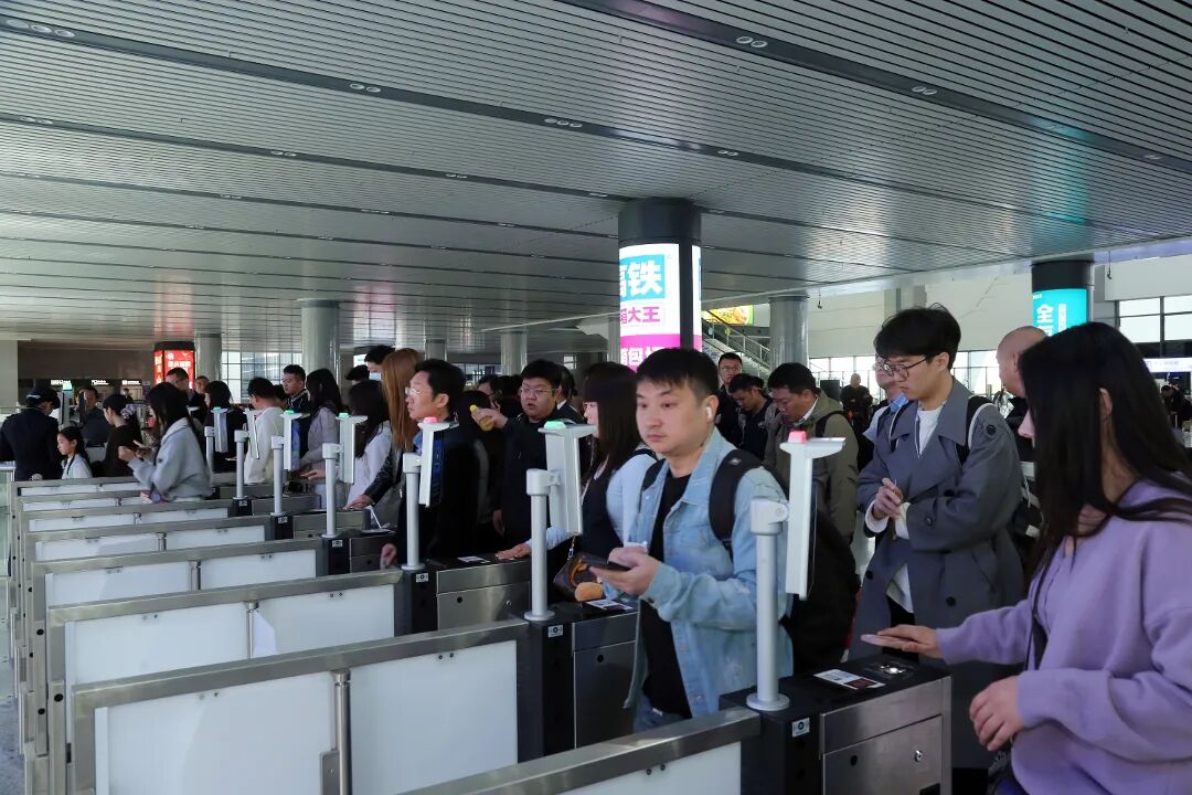 Passengers at the ID-verification gates at the entrance of a Chinese high-speed rail station