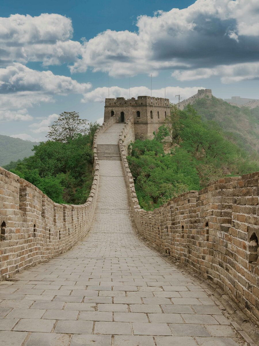 Mutianyu Great Wall section on a mountain ridge north of Beijing — restored Ming-dynasty battlements and watchtowers.