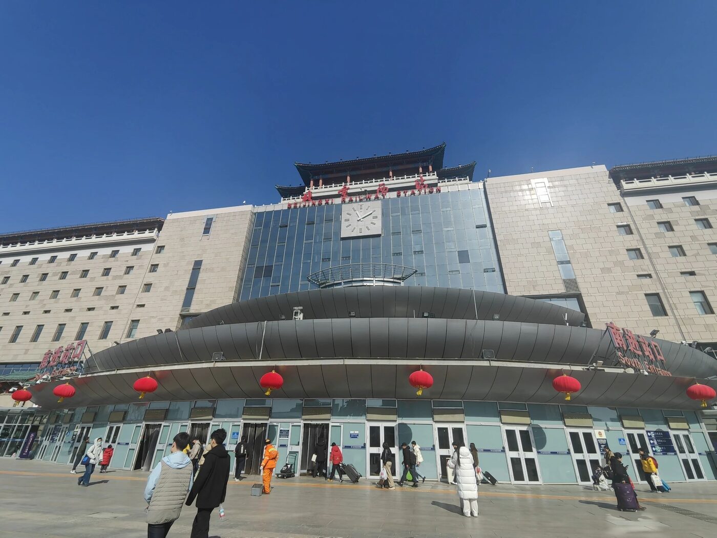 The pavilion-topped facade of Beijing West Railway Station with its station-front plaza.