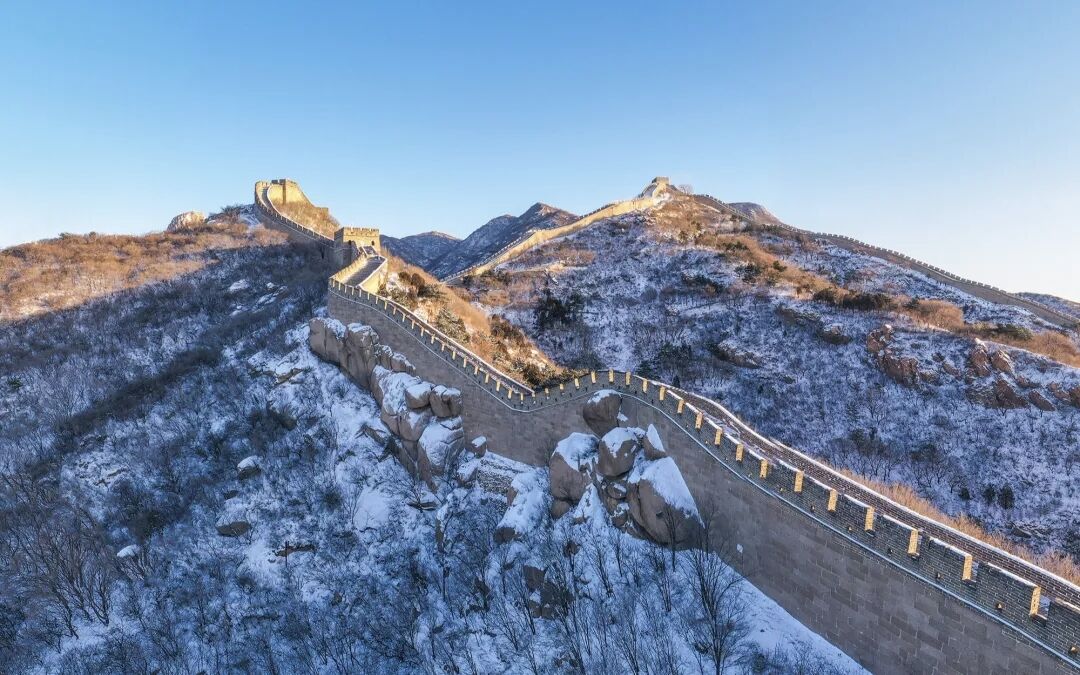 The Great Wall of China snaking along forested ridgelines outside Beijing — the headline day trip from the city.