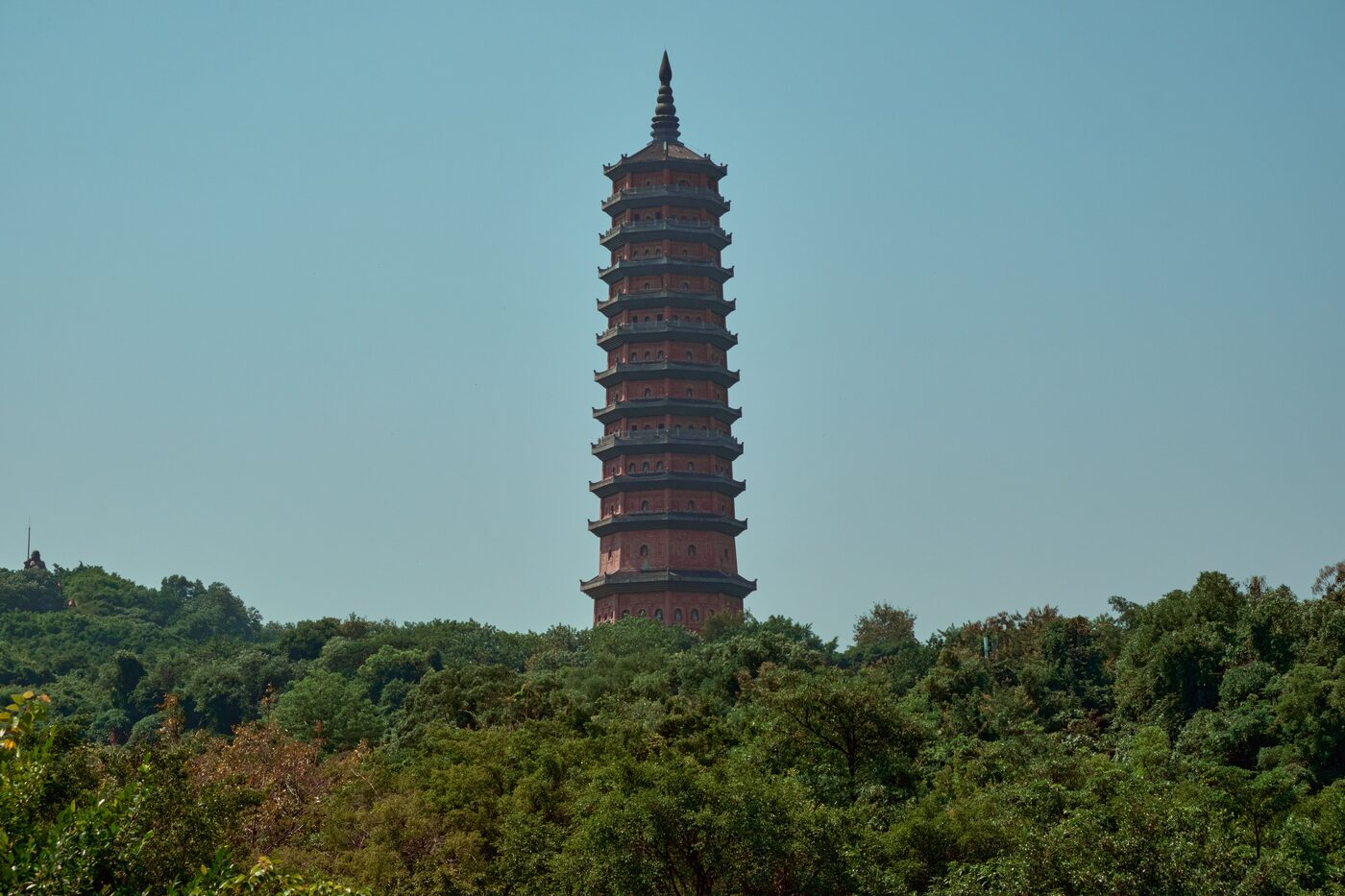 Leifeng Pagoda on the south shore of West Lake, Hangzhou, rising above the trees.