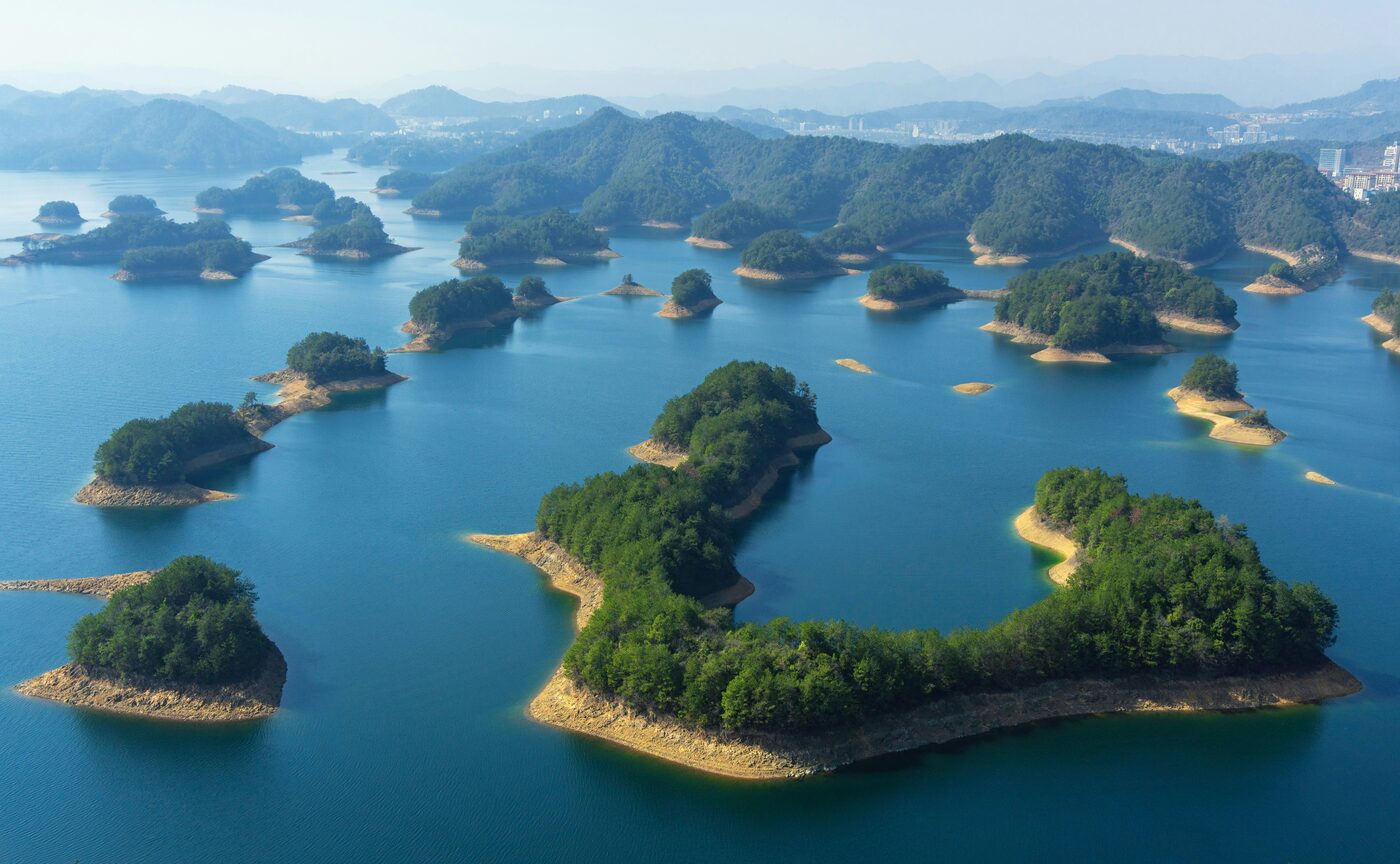 Qiandao Lake (Thousand Island Lake) near Hangzhou — green islets scattered across a wide reservoir.