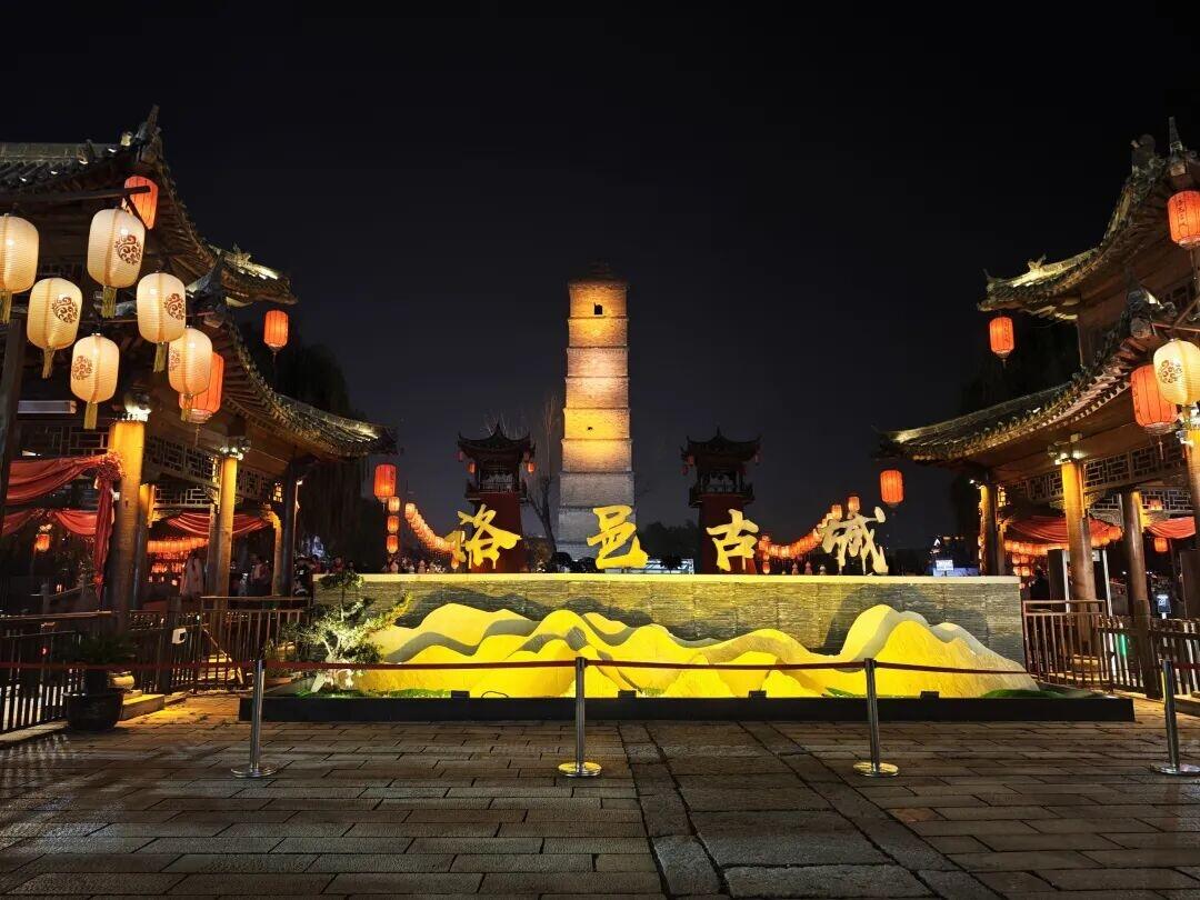 A restored Tang-era courtyard quarter at Luoyi Ancient City in Luoyang's old town, with traditional grey-tiled halls.