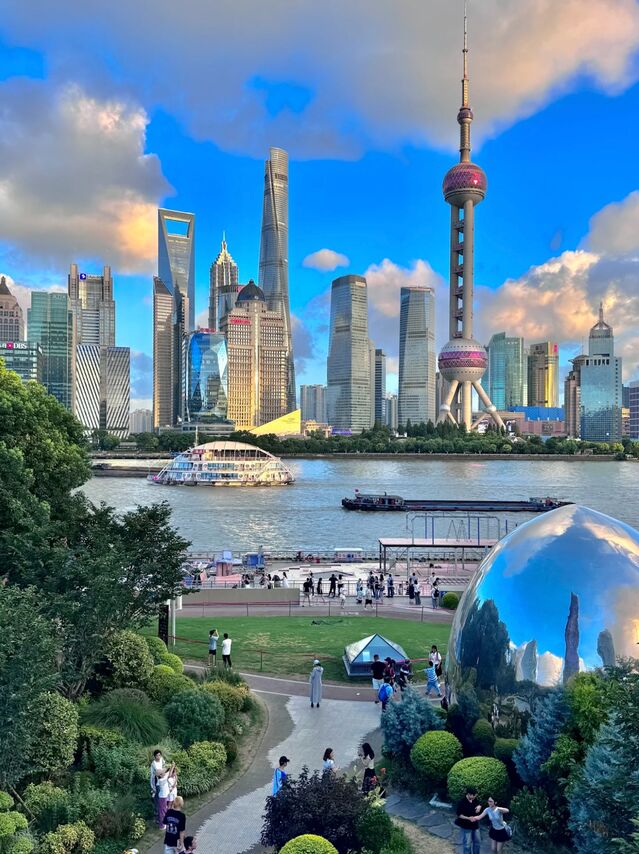 The Bund by day — the row of early-20th-century neoclassical and Art Deco buildings along the Shanghai waterfront, seen in daylight.