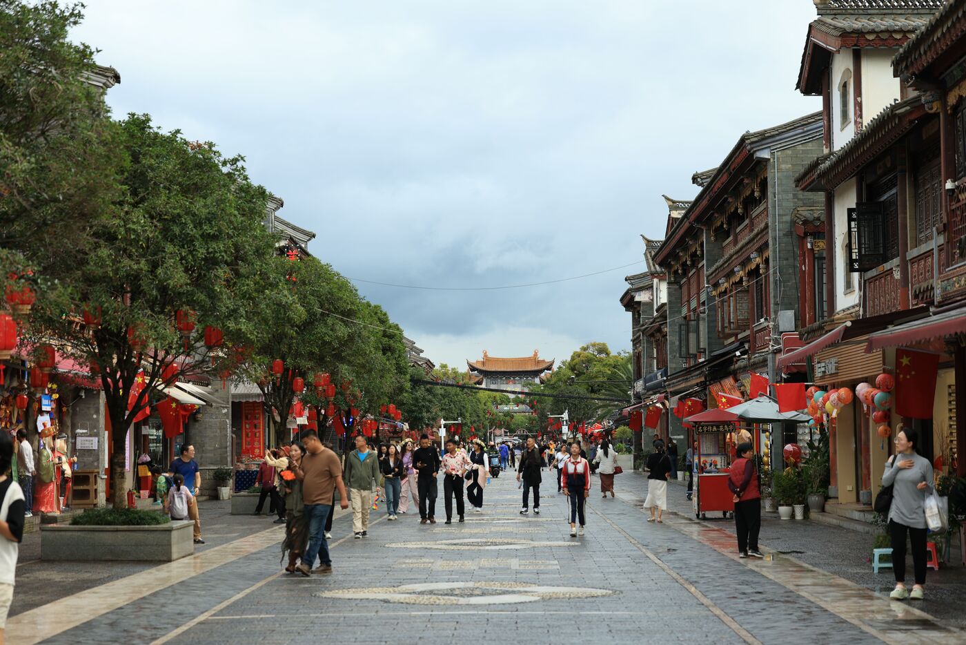 Dali Old Town in Yunnan with the Cangshan mountains behind the tiled roofs and town gate.