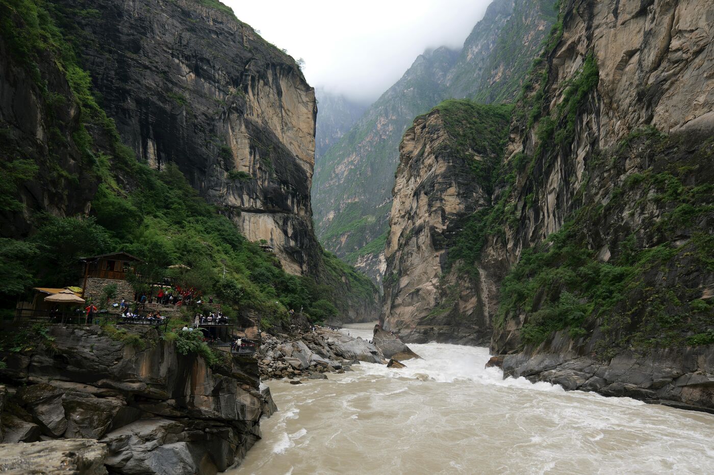 Tiger Leaping Gorge in Yunnan — the Jinsha River channelled between near-vertical cliffs below snow peaks.