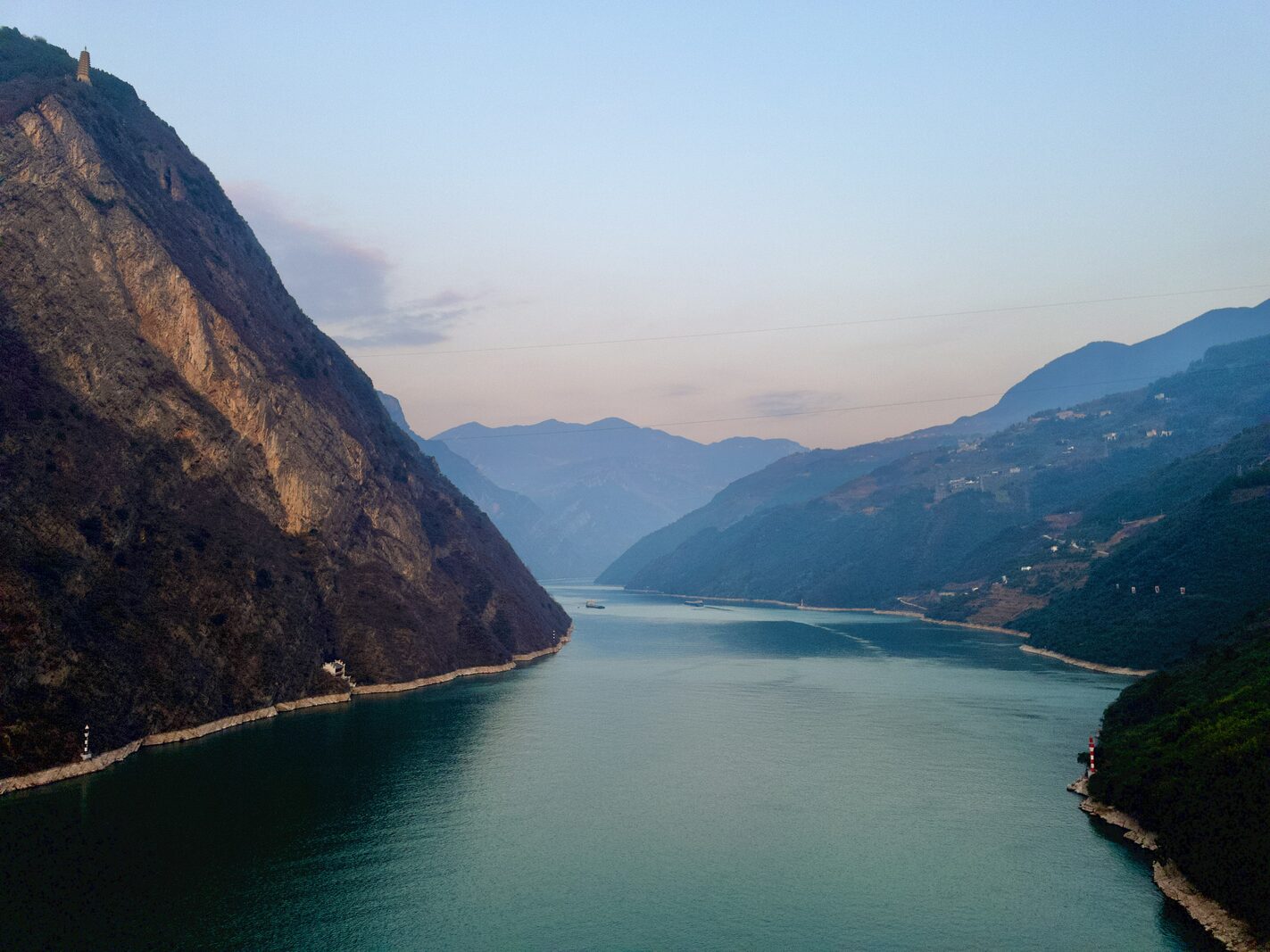 River cruise ship sailing through the Three Gorges of the Yangtze River.