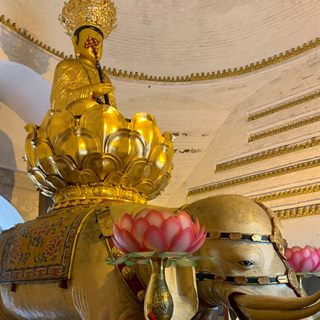 The 980 CE bronze Samantabhadra riding a white elephant inside its vaulted hall at Wannian Temple, Mount Emei.