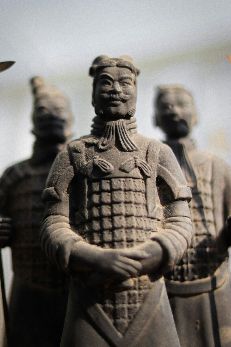Close-up of a single terracotta general showing an individually sculpted face and detailed armour, Xi'an.