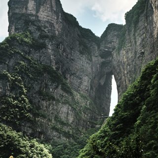 The Tianmen cave — a vast natural arch through the cliff of Tianmen Mountain.